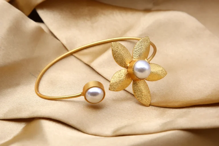 Golden Pearl Floral Open Bracelet with textured flower design