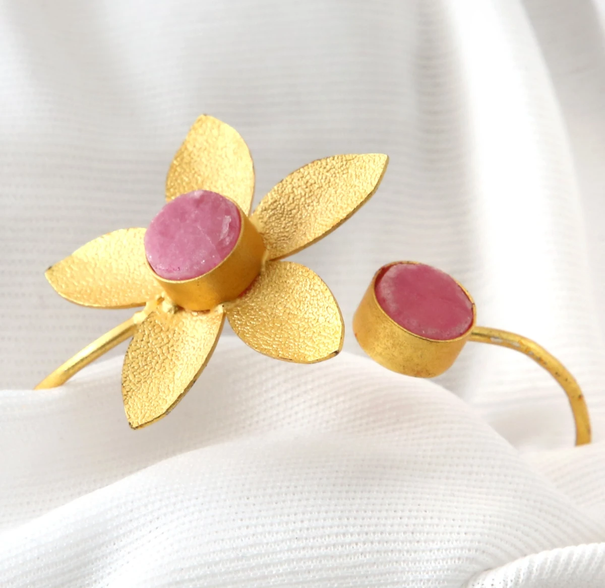 pink-floral-stone-bracelet-front Golden floral open bracelet with pink stone detailing