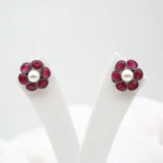 Ruby pearl floral stud earrings with antique silver finish and Monalisa stones