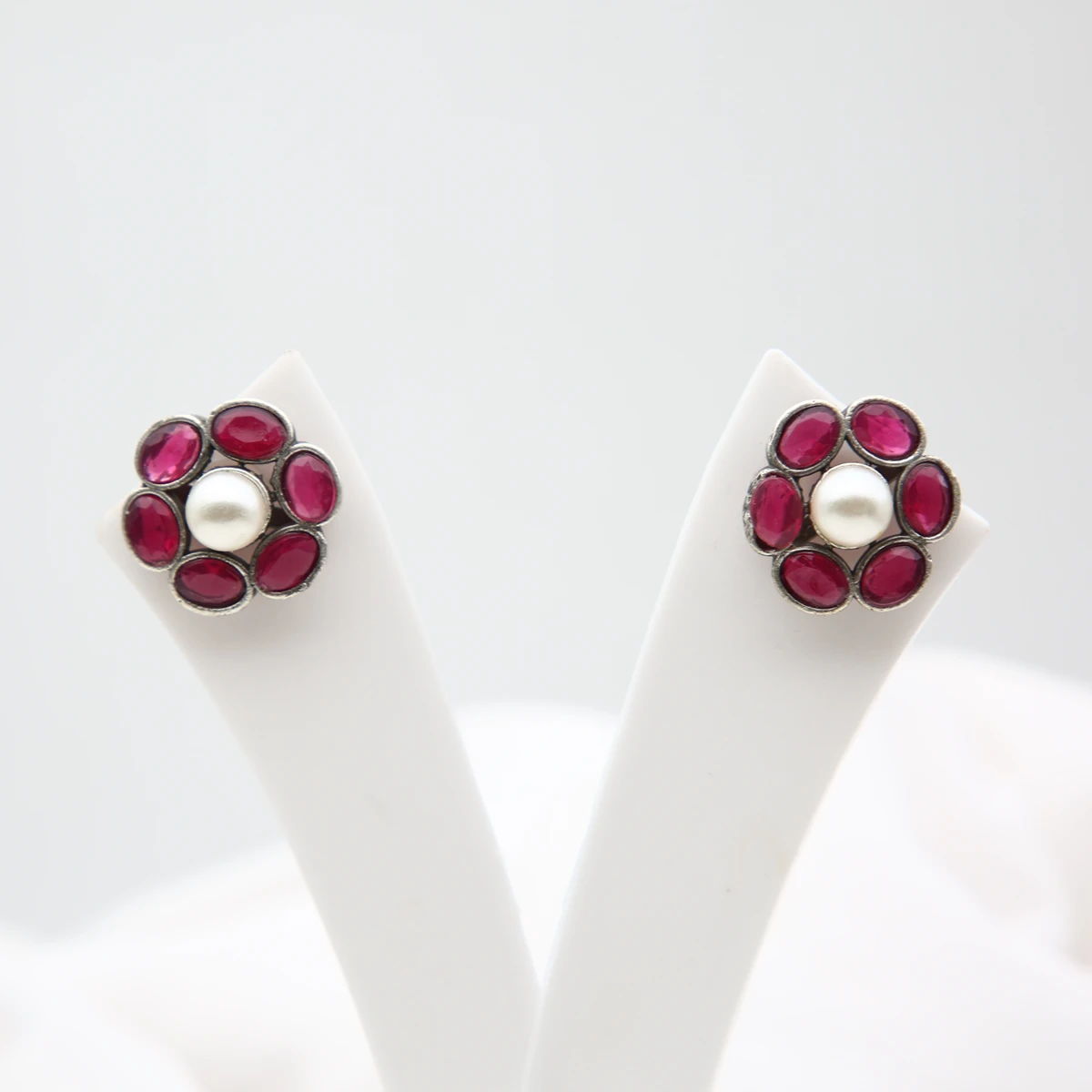 ruby-pearl-floral-stud-earrings-front Ruby pearl floral stud earrings with antique silver finish and Monalisa stones